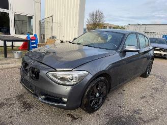 damaged passenger cars BMW 1-serie 116i Business AUTOMAAT 2011/11