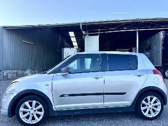 škoda osobní automobily Suzuki Swift 1.3i 92pk GLS 5drs - nap - airco - camera - touchscreen multimedia - bleutooth - alcantara hemel + stuur 2006/10