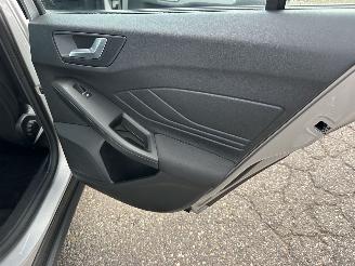 Ford Focus Wagon 1.0 EcoB Hybrid 135pk 6-bak Con - 97dkm nap - navi - airco - cruise - pdc - line + front assist - lmv picture 63